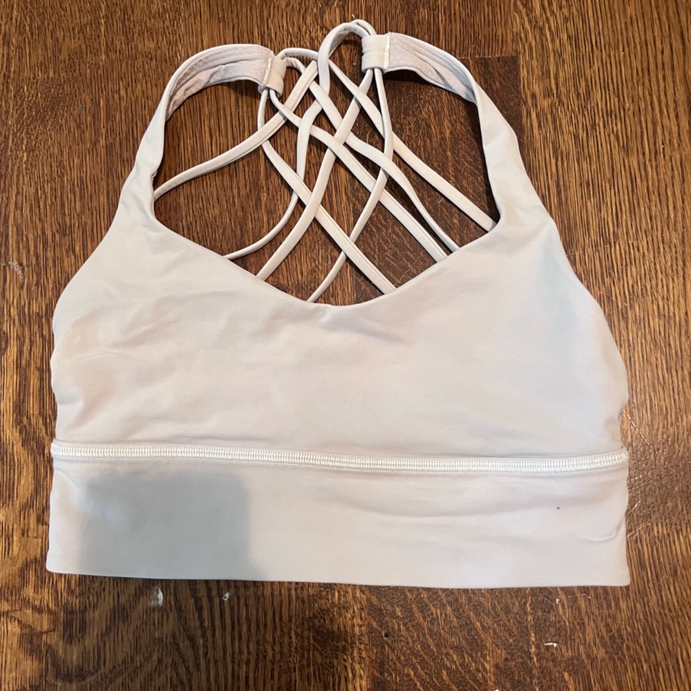 White Lulu Lemon align bra with band across bottom and criss cross back